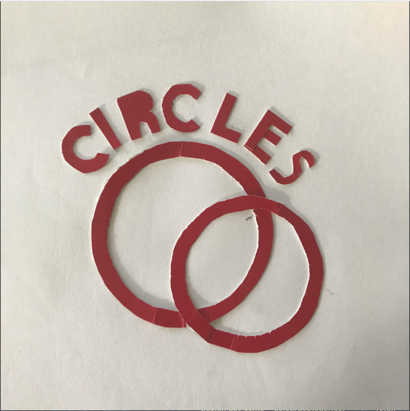 Red CIRCLES text logo with two interlocking circular rings on white textured background