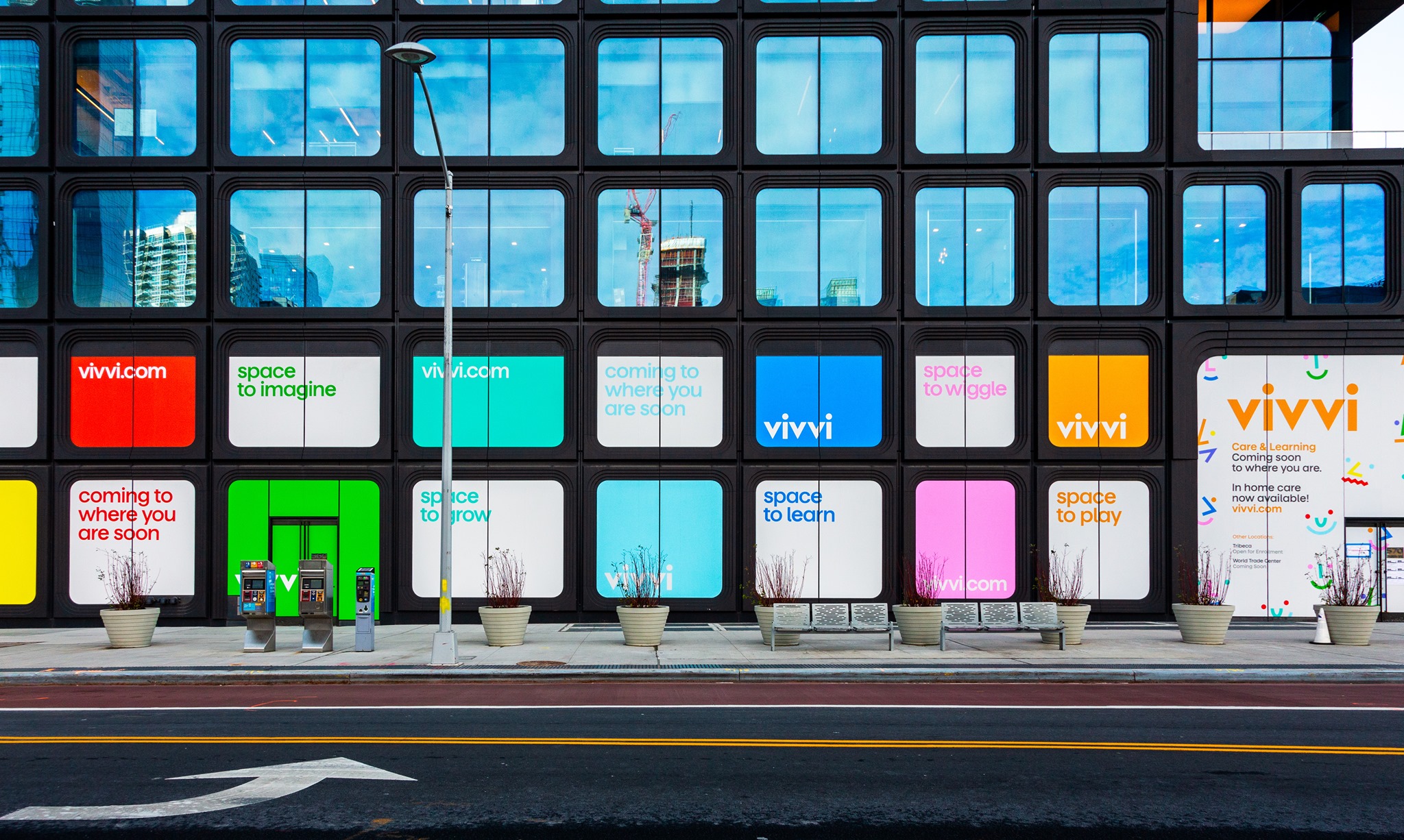 Vivvi childcare center storefront with colorful window displays featuring brand messaging and space to themed signs