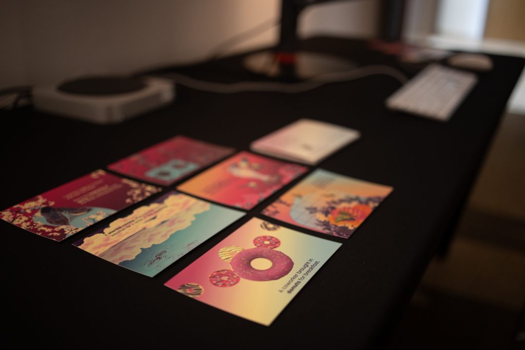 Colorful tarot cards spread on dark table with donuts design, vintage style divination deck for fortune telling reading