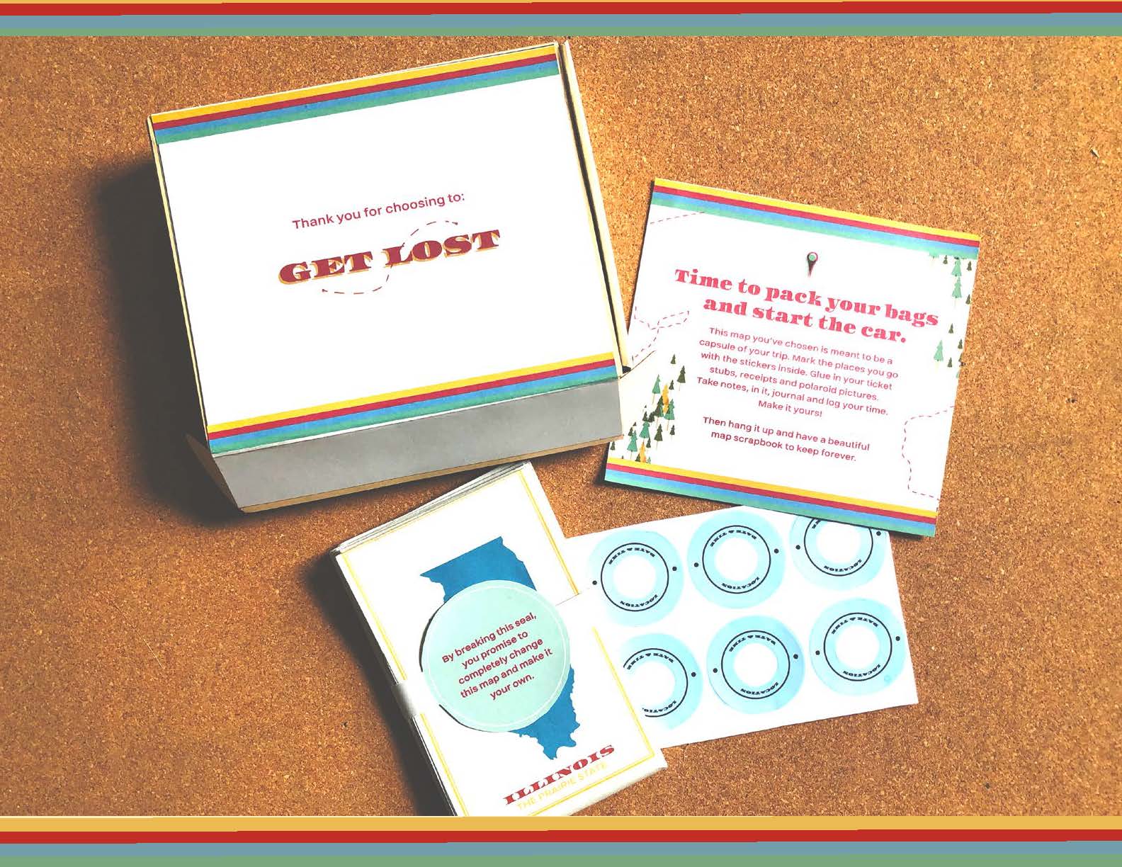 Paper Maps - 1 Get Lost travel kit with colorful rainbow-striped packaging, map, stickers, and Illinois state outline card