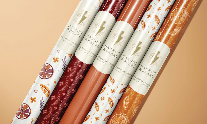 12_GarnetPearl Garnet & Pearl wrapping paper rolls with autumn-themed designs including oranges, leaves, and warm color patterns